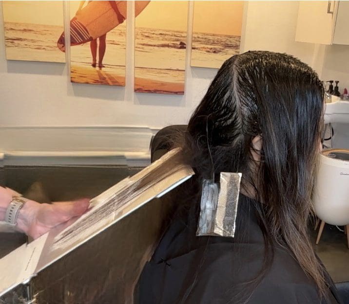 Airtouch vs. Teasy lights -highlighting techniques on brunette hair showing soft blended color and dimensional ribbons