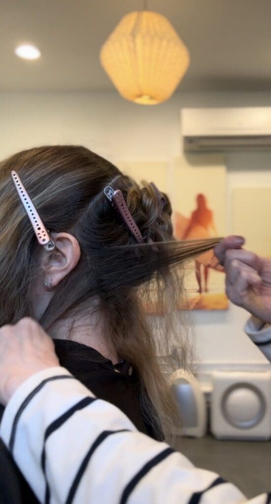 Airtouch vs. Teasy lights -highlighting techniques on brunette hair showing soft blended color and dimensional ribbons