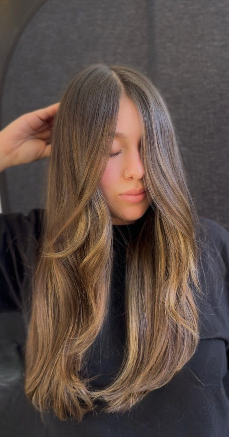 Dimensional brunette highlights created using high lift color instead of bleach